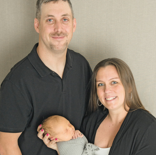Katie LaChance Elwell '08 with husband Michael and son Brody