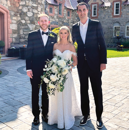 Courtney Parent '10, RJ O'Brien '10, and Head Men's Basketball Coach and officiant Aaron Galletta