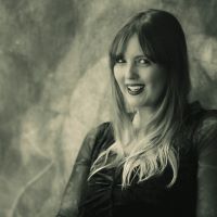 smiling white woman with long two-tone hair