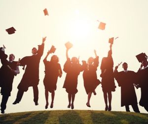 graduate students throwing caps scholarship for masters program