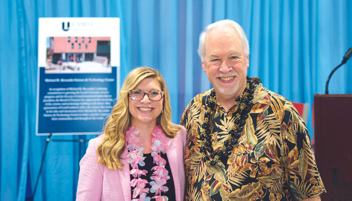 Carrie Goodwin Kenniston '13 and Michael B. Alexander at his retirement celebration