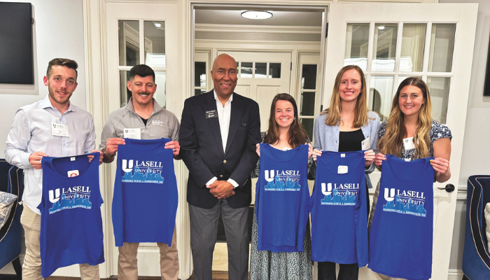Lasell's Boston Marathon team with President Eric Turner