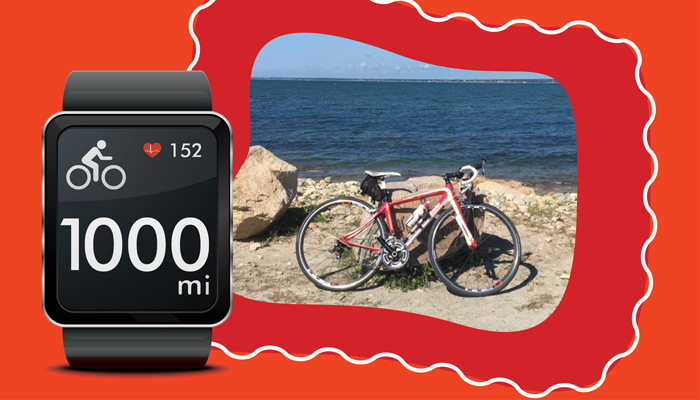 Picture of bicycle and smartwatch showing 1,000 miles rode