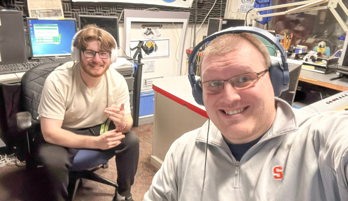 Elliot Pototsky '25 and Justin Miller '14 work together