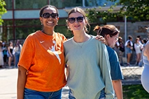 two female Lasell students standing outside