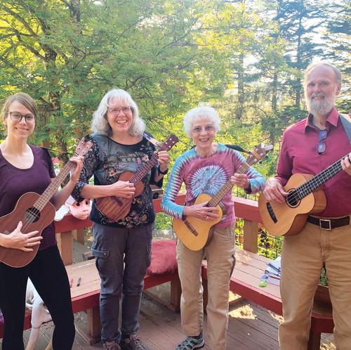 Dot Day Bardarson '53 playing ukelele with family