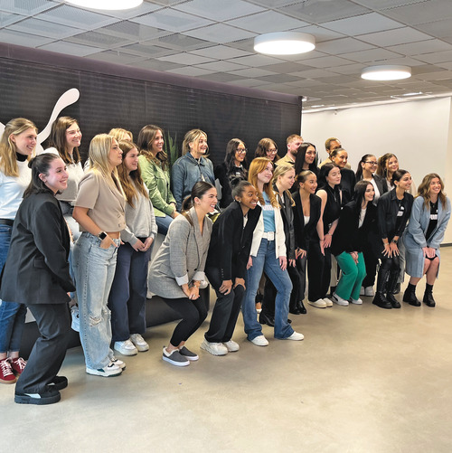 Katie Stopera '16 with Lasell students and alumni at PUMA headquarters in Somerville, Massachusetts