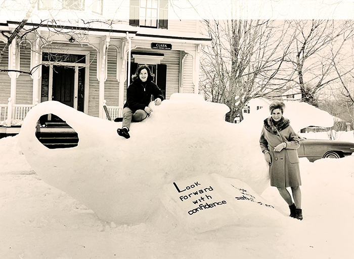 Lasell students show off a snow sculpture in front of Clark House in the 1960s