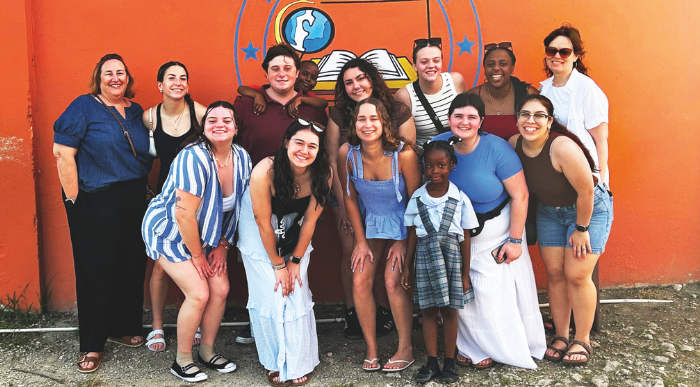 Lasell University students and faculty with local Antiguan students on a Shoulder to Shoulder immersion trip