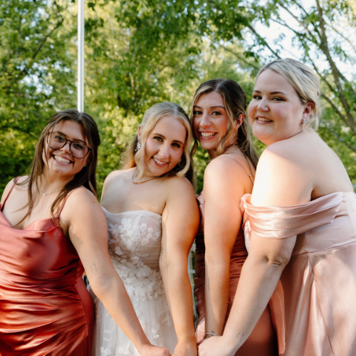 Sarah Kelly '20 and Lasell alumni at her wedding