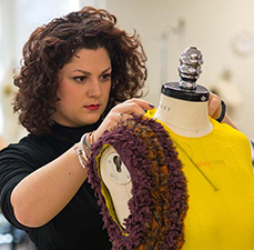 student with mannequin, making a garment