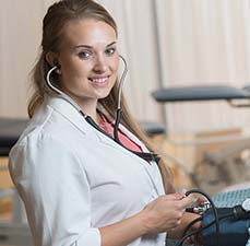 student with stethoscope and lab coat
