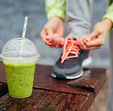 green shake, person tying shoe